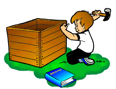 Boy finishing building a doghouse